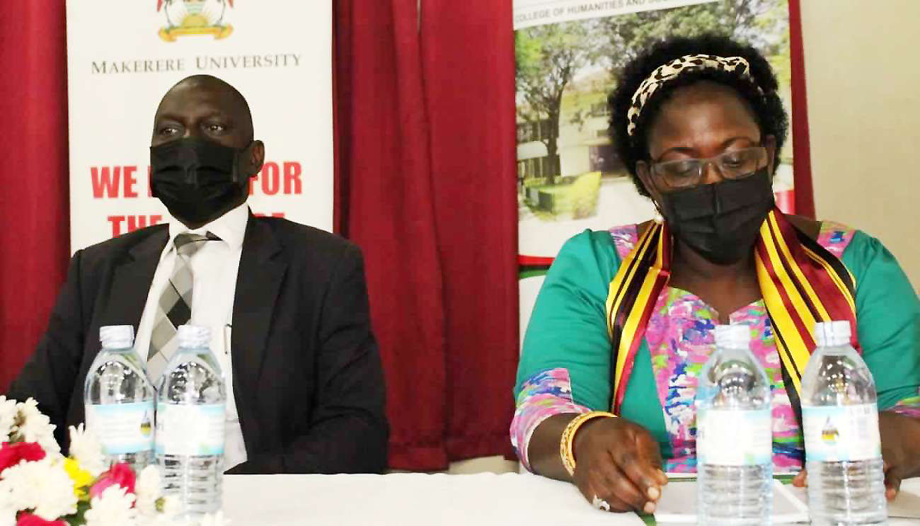 The Principal and Deputy Principal CHUSS, Prof. Josephine Ahikire (R) and Dr. Julius Kikooma (L) respectively at the event on 9th December 2021, CEDAT Conference Hall, Makerere University.