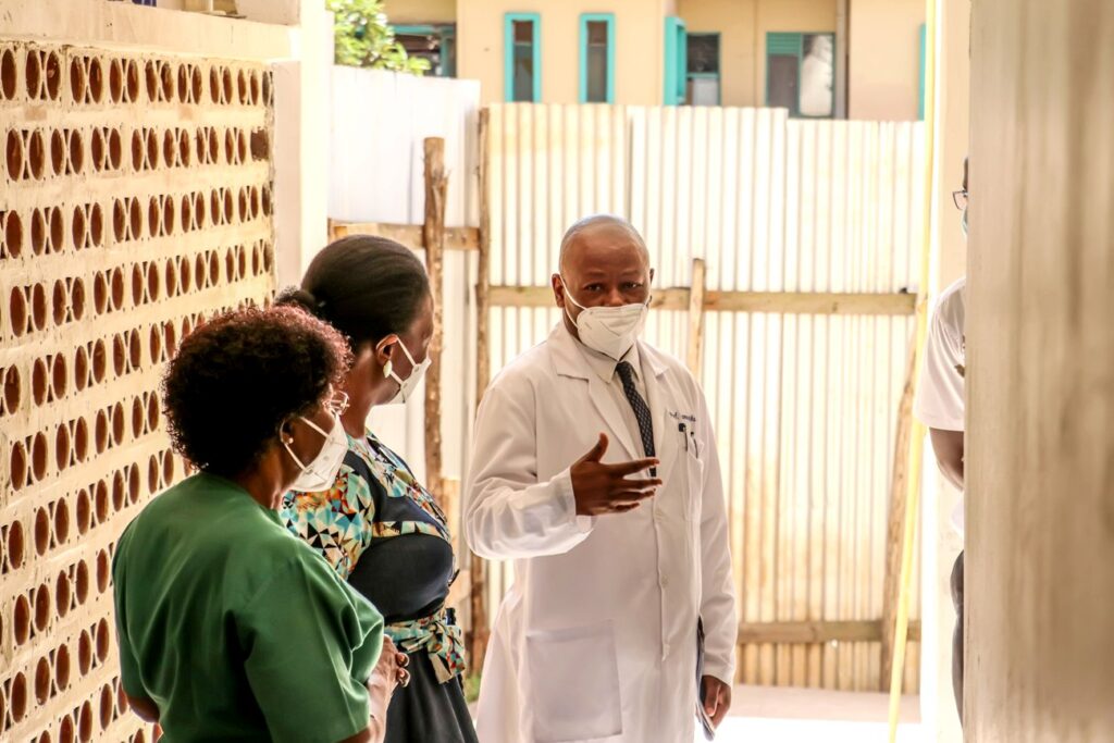 Dr. Josaphat Byamugisha, the University Hospital Director (3rd L), Estates and Works Director Eng. Christina Kakeeto (2nd L) and other officials chat during the event.