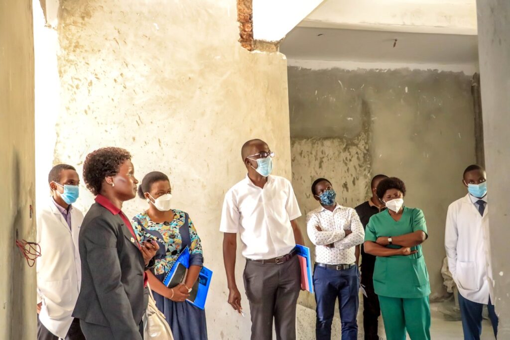 The DVCFA (L), Estates and Works Director Eng. Christina Kakeeto (2nd L), Eng. Ezra Sekadde (3rd L) and University Hospital Staff tour part of the Hospital under refurbishment.