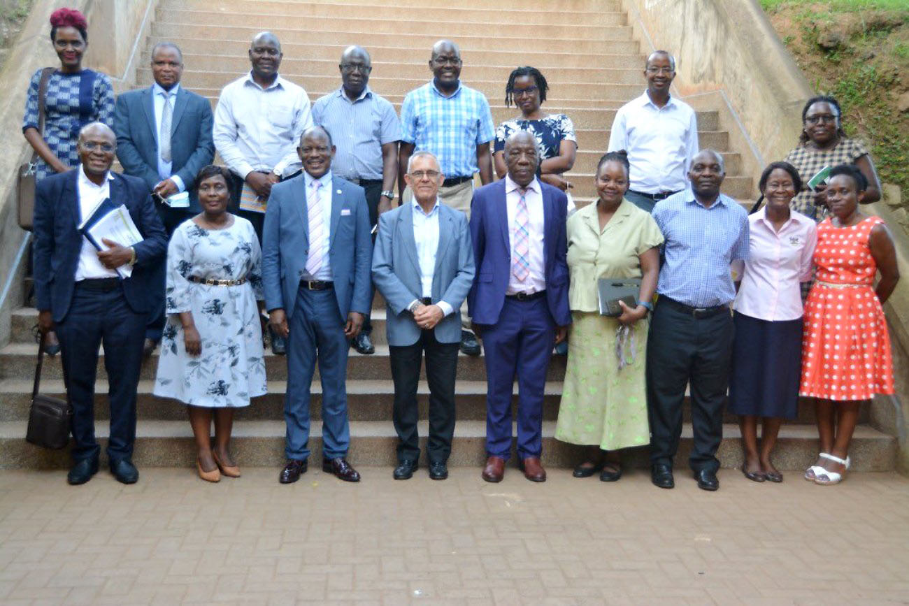 The Vice Chancellor, Prof. Barnabas Nawangwe (3rd L), Prof. Izael Izael Pereira Da Silva (4th L), Principal CEDAT-Prof. Henry Alinaitwe (C), Deputy Principal CEDAT-Assoc. Prof. Venny Nakazibwe (2nd L) and other officials after the meeting on 13th December 2021, Makerere University.