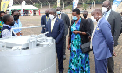 The Government Chief Whip, Hon. Thomas Tayebwa (3rd R), State Minister for Water, Hon. Aisha Sekindi (2nd R), Vice Chancellor, Prof. Barnabas Nawangwe (R) and other officials listen to an exhibitor at the Appropriate Technology Exhibition on 26th November 2021 at the Kololo Independence Grounds.