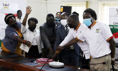 The Vice Chancellor, Prof. Barnabas Nawangwe (3rd R) is joined by the Principal, Assoc. Prof. Josephine Ahikire (L) and CHUSS Staff to cut cake during the handover ceremony on 15th December 2021.