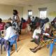 One of the facilitators interacts with participants during the training in Lamwo District. Photo credit: RAN