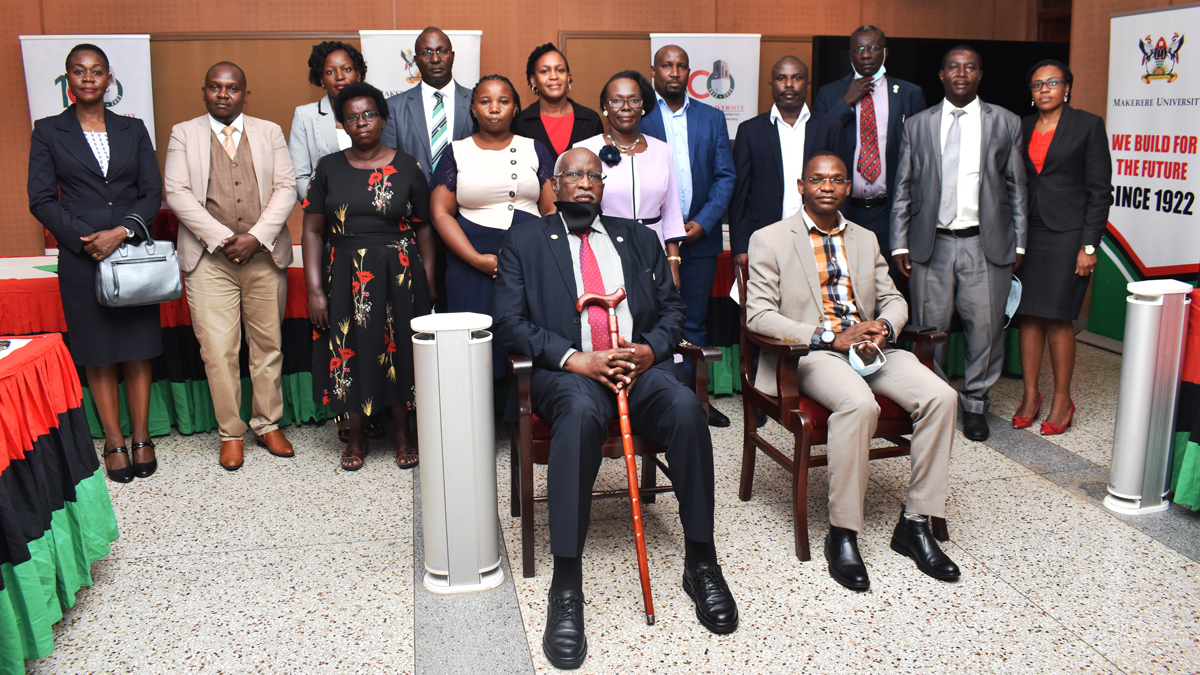 Front Row: The Chairperson Staff Appeals Tribunal-Justice Dr. Patrick Tabaro (L) and Deputy Vice Chancellor (Academic Affairs)-Dr. Umar Kakumba (R) with members of Management and the Tribunal after the swearing-in ceremony on 20th December 2021, CTF1, Makerere University.