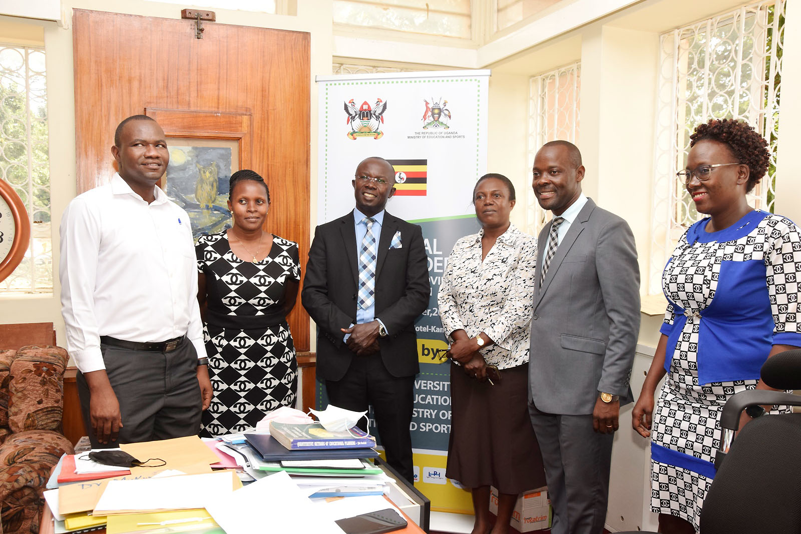 Outgoing HoD-Dr. Nambi Rebecca (3rd R) and Incoming HoD-Dr. Muhammad Kiggundu Musoke (3rd L) with the Dean SoE-Dr. Mathias Mulumba (2nd R), CEES HR Officer-Mr. Godfrey Makubuya (R), Ms. Betty Kyakuwa and another official at the handover ceremony on 13th January 2022.