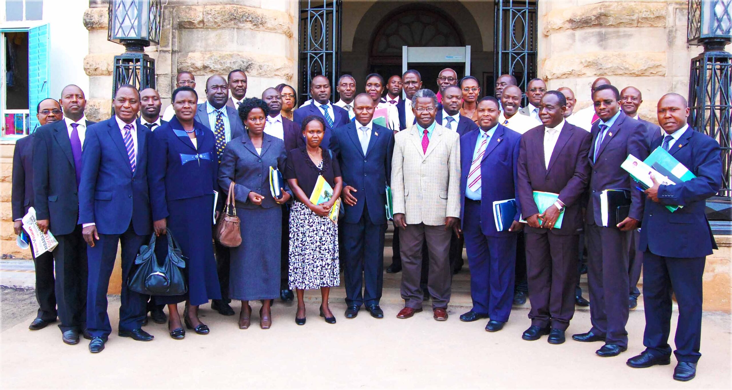 The Parliamentary Select Committee on Science and Technology poses for a group photo with members of Management after their visit.