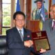 Hon. Kang Ha Kuk, Minister of Health of DPRK (C) receiving a plaque from The Chancellor, Makerere University Prof. George Mondo Kagonyera (R) during the visit on 31st October 2014.