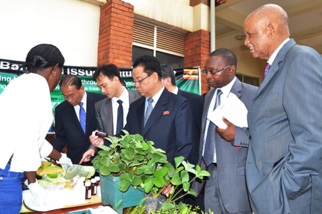 R-L Prof. George Mondo Kagonyera, Prof. John Muyonga, Hon. Kang Ha Kuk and part of the Korean delegation admire products made by the School of Food  Technology, Nutrition and Bioengineering.