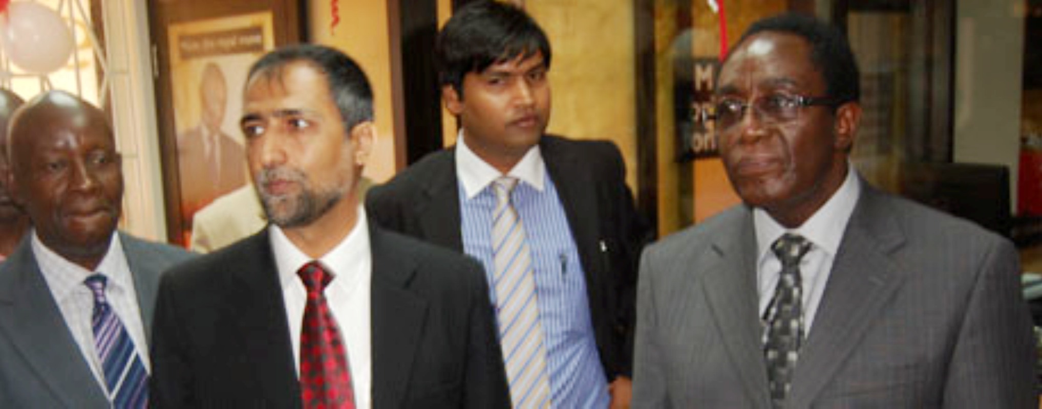 The Vice Chancellor Prof. John Ddumba Ssentamu (Extreme Left), together with the Crane Bank team at the official opening of the Makerere University Branch on 12th September 2012.