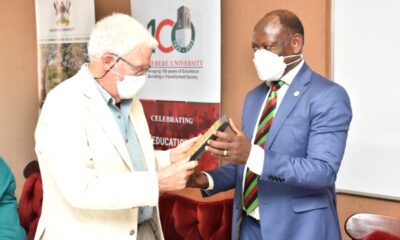 Prof. Barnabas Nawangwe (R) presents a plaque to Prof. Hugh Rowell (L) in appreciation of his donation as part of Mak@100 Celebrations.