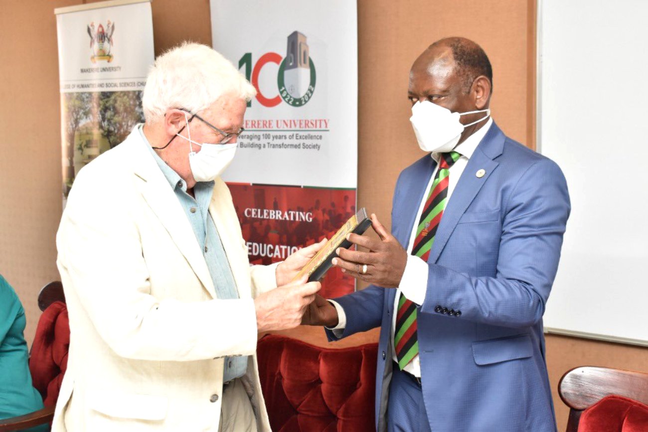 Prof. Barnabas Nawangwe (R) presents a plaque to Prof. Hugh Rowell (L) in appreciation of his donation as part of Mak@100 Celebrations.