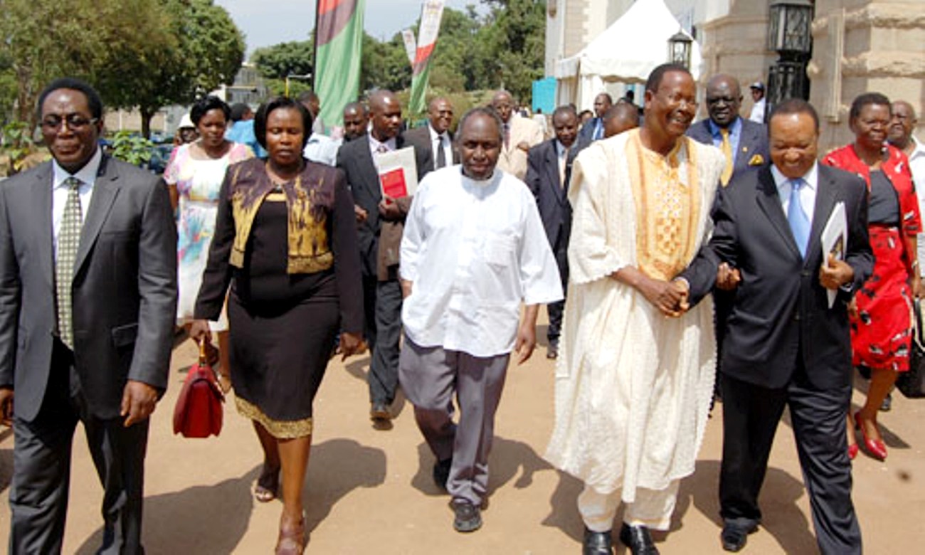 Vice Chancellor Prof. J. Ddumba-Ssentamu (L) leads L-R Hon. Jessica Alupo, Prof. Ngugi wa Thiong'o, Prof. Ephraim Kamuntu and Rt. Hon. Apolo Nsibambi to a tour of the mini-exhibition at the UEA 50th Anniversary celebrations 29th June 2013, Makerere University, Kampala Uganda.