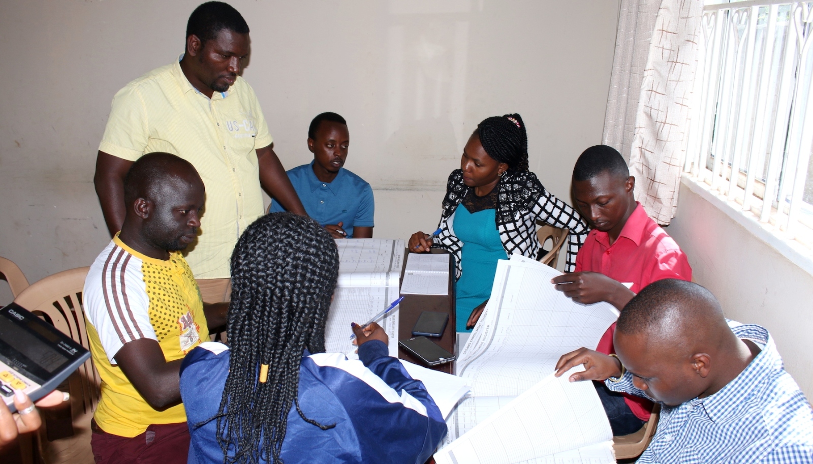 A team from METS carrying out data quality assessment in Mityana District. Photo credit: MakSPH-METS