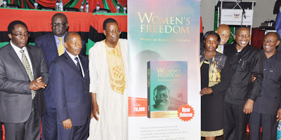 Dignitaries pose with a dummy of Mwalimu Julius Nyerere's book, ‘Women’s Freedom: Women are Eagles, Not Chickens,’