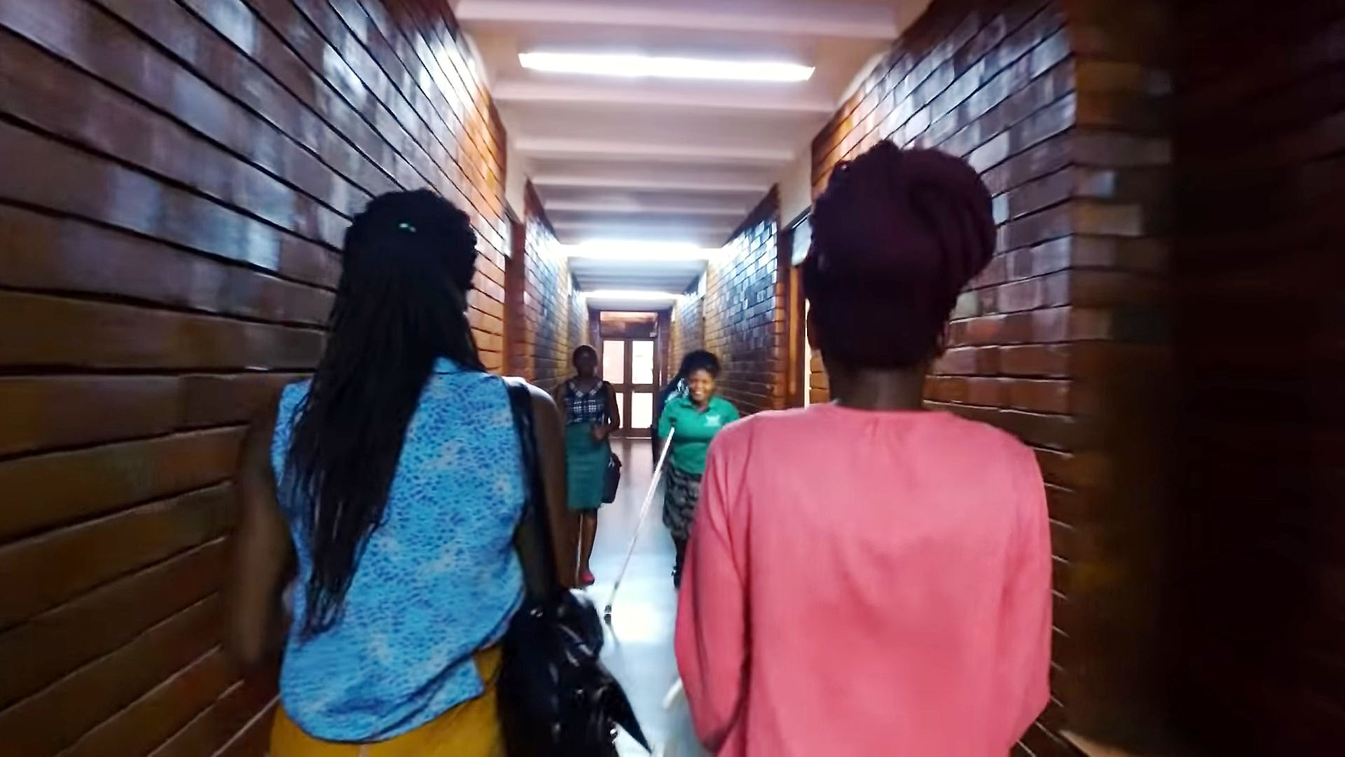 Female Students in the corridors of Africa, one of the Halls of Residence for Ladies at Makerere University.