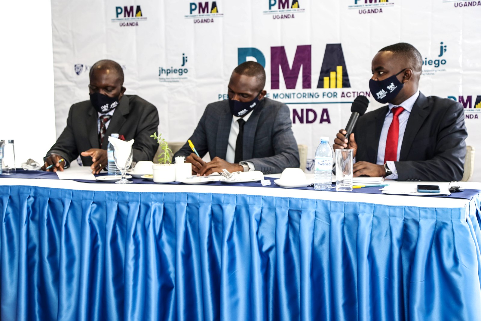 L-R: MakSPH, PMA Uganda project leaders Principal Investigator Dr. Fredrick Makumbi and Co-Principal Investigator Dr. Simon Peter Kibira alongside Dr. Richard Mugahi Adyeeri, the Assistant Commissioner in charge of Reproductive and Infant Health, MoH at the Stakeholders Dissemination on 15th February 2022, Golden Tulip Hotel, Kampala.