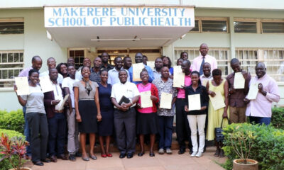 The Head, Department of Epidemiology and Biostatistics-Prof. Nazarius Mbona Tumwesigye (6th L) and the Head, Department of Disease Control and Environmental Health-Dr. Esther Buregyeya (4th L) pose with 25 graduands of the WASH Short Course on 20th July 2018, MakSPH, Mulago Campus, Makerere University.
