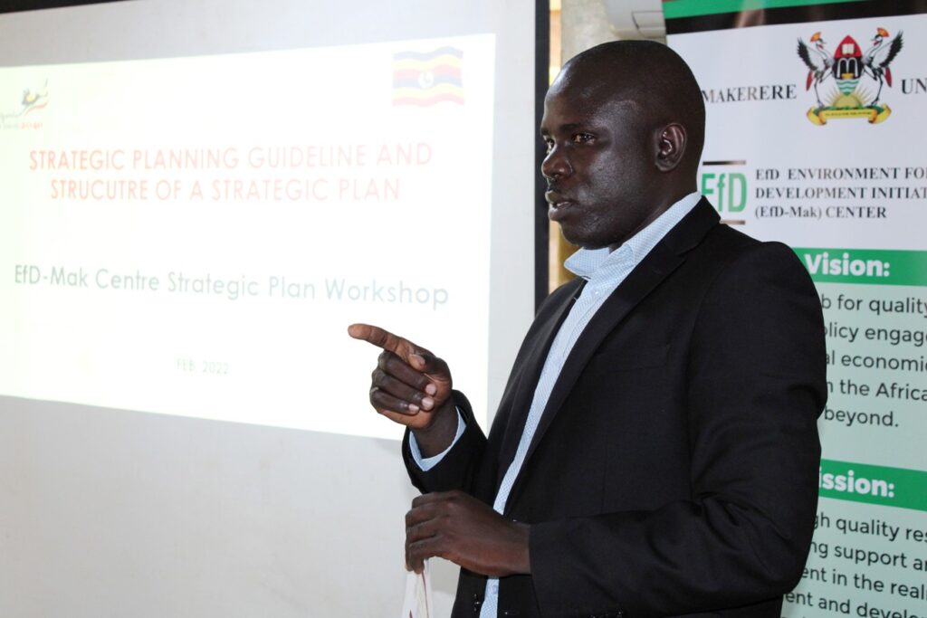 Epiaka William from the National Planning Authority participating during the strategic plan meeting.