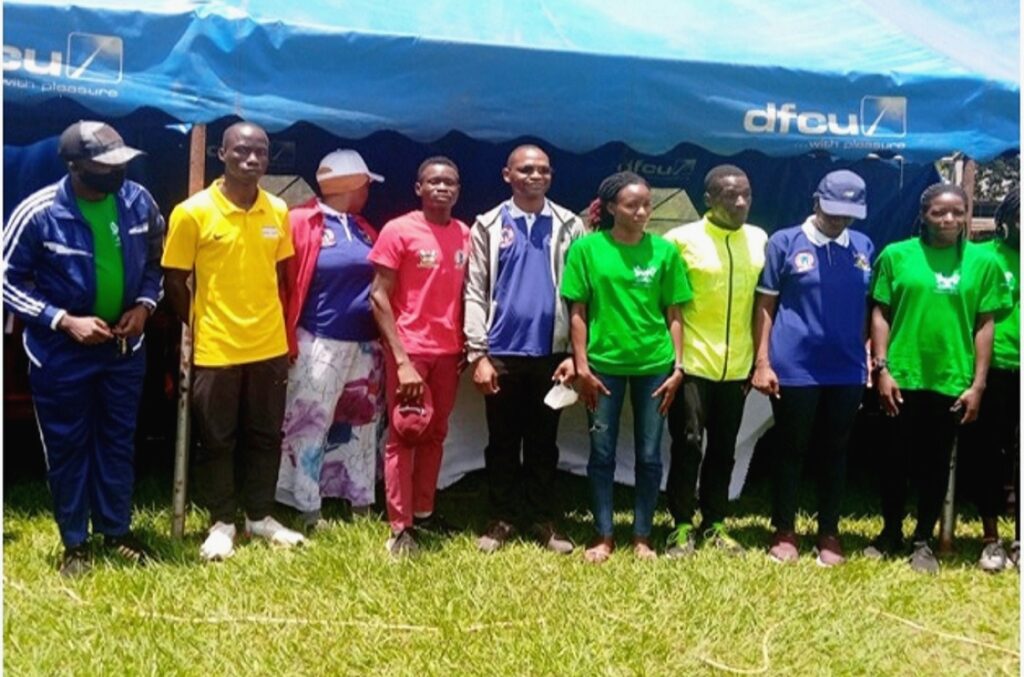 Associate Professor Umar Kakumba (Middle) Mrs. Winfred Kabumbuli (Second from Right) Kajoba Hamza (First from Left) and Dr. Sauda Namyalo (Third from Left) with winners of the mini-marathon. (Photo by Alex Mugalu)