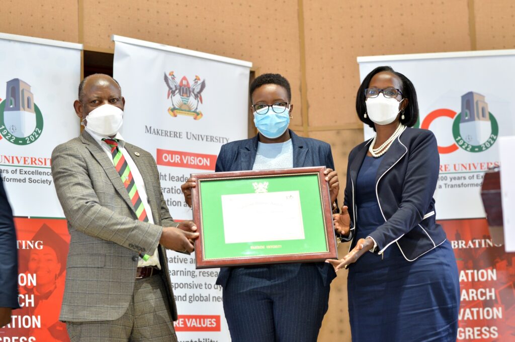 The KCCA Deputy Lord Mayor, Her Worship Doreen Nyanjura (C) receives his Eminent Service Award from Council Chairperson, Mrs. Lorna Magara (R) and Vice Chancellor, Prof. Barnabas Nawangwe (L). 