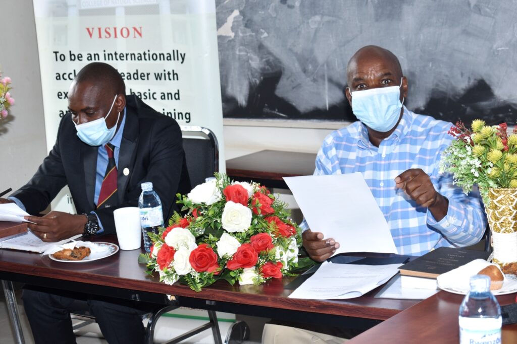 he outgoing Principal CoNAS, Prof. J.Y.T. Mugisha (R) presenting his handover report to the incoming Principal, Dr Tumps Winston Ireeta (L).