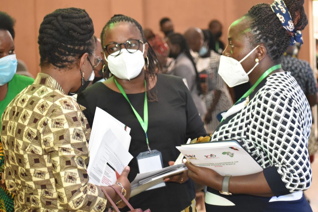 Assoc. Prof. Sarah Ssali (L) interacts with some of the participants at the conference.