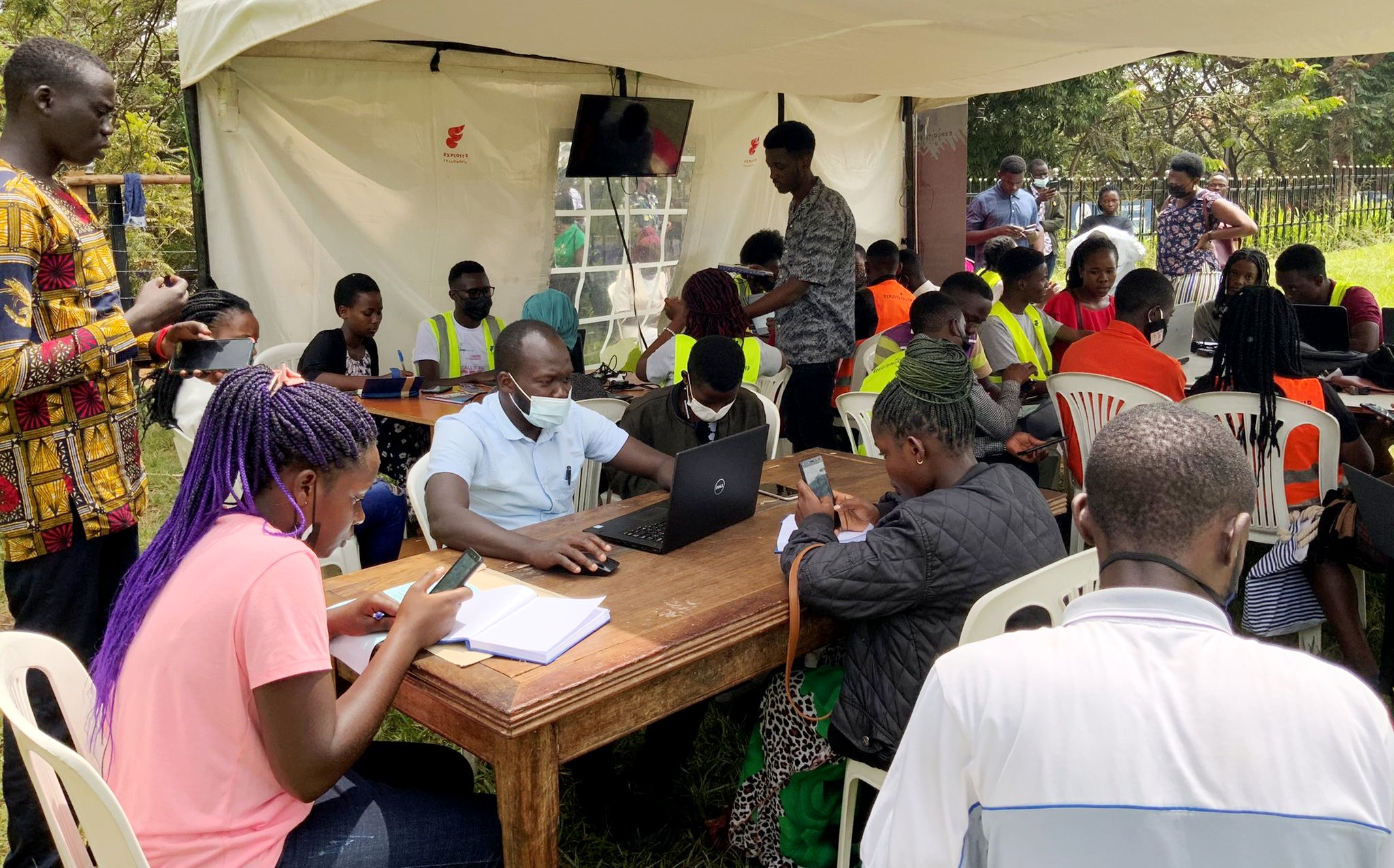 DICTS Staff are joined by volunteers to offer ICT Services to students at the Freedom Square, Makerere University on 25th February 2022.