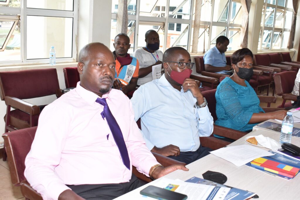 Dr. Frank Mugagga (C) with other Participants during the Transport and Covid-19 Symposium