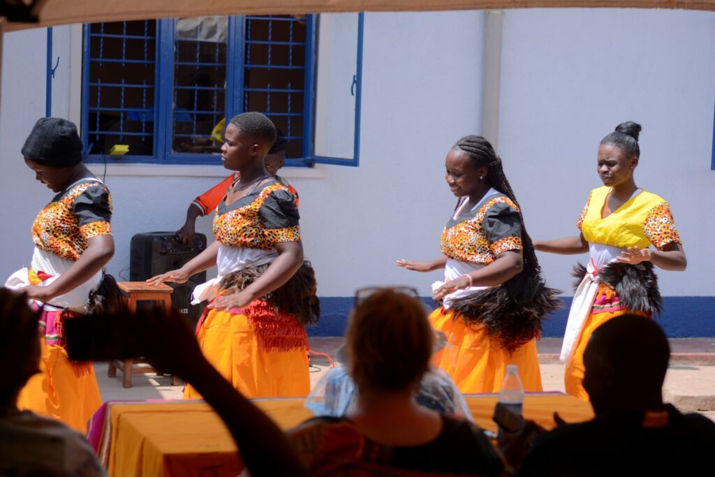 Some of the young women beneficiaries of the project entertain visitors at the Bwaise UYDEL site