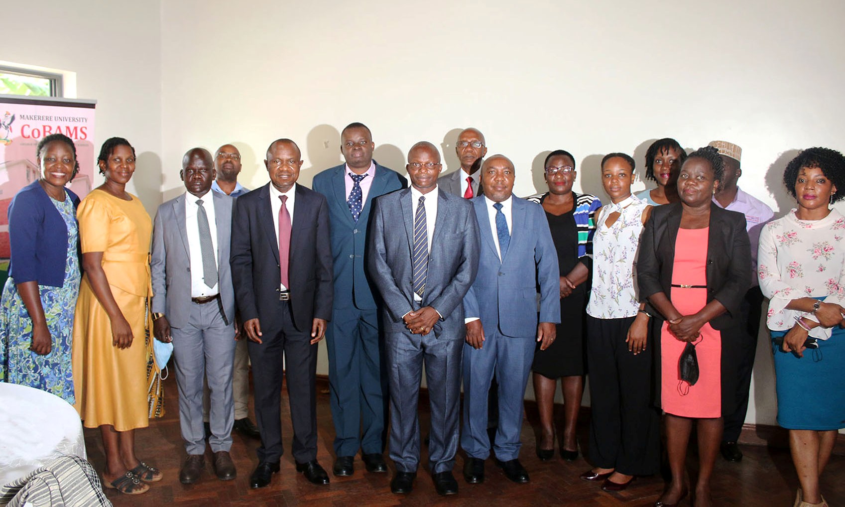 Mr. Fred Ngabirano, Commissioner, Children and Youth Affairs, Ministry of Gender, Labour and Social Development (9th L) with Principal CoBAMS-Prof. Eria Hisali (5th L), Dean SSP-Dr. James Wokadala (7th L), Ag. Head DPS & PI-Dr. Stephen O. Wandera and other participants at the dissemination on 10th March 2022.