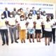 Rear R-L: Principal CoBAMS-Prof. Eria Hisali, Mr. Ashaba Hannington-MoFPED, Jordan Martindale-FCDO, Ms. Mukami Kariuki-World Bank Country Manager Uganda, Prof. Edward Bbaale-PI PIM CoE and Dr. Willy Kagarura-Manager PIM CoE with some of the trainees who received certificates in Financial and Risk Analysis on 10th March 2022, Freedom Square, Makerere University.