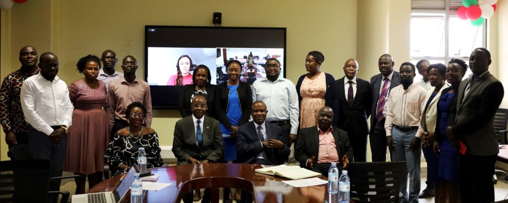 Workshop participants and IGE Fellows pose for a group photo with Assoc. Prof. Eria Hisali (Seated 2nd R) and Prof. Edward Bbaale (Seated 2nd L) after the Induction.