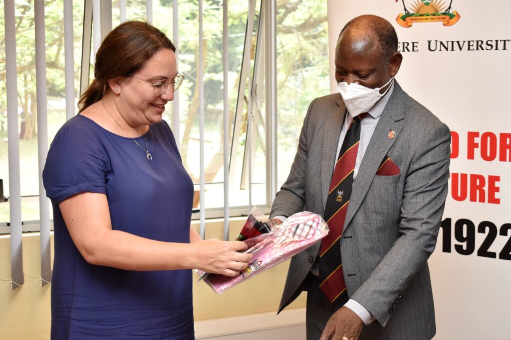 Prof. Barnabas Nawangwe (R)  presents an assortment of Makerere branded souvenirs to H.E. Dvora Dorsman Yarkoni (L) during the courtesy call. 