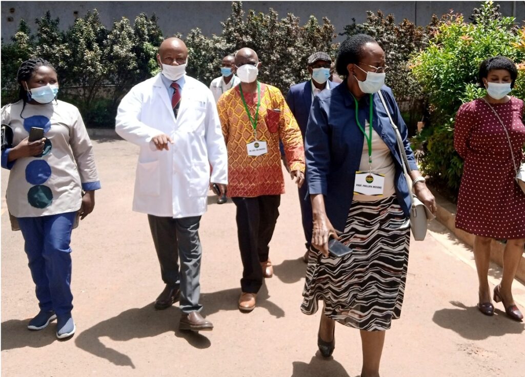 Dr. Bira Migrate (L),  Prof. Josaphat Byamugisha (2nd L),  Prof. Phillipa Musoke (2nd R) and other Members of the Medical School Class of 1976 during their tour of the University Hospital premises.  (Photo by Alex Mugalu)