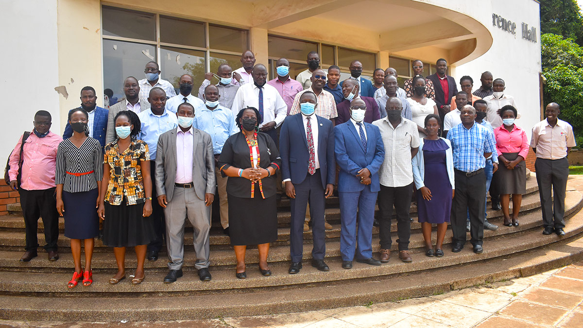 University Bursar-Mr. Evarist Bainomugisha (Front 4th Left), Head Grants Administration and Management Support Unit-Prof. Grace Bantebya (Front 5th Left), University Secretary-Mr. Yusuf Kiranda (Front 6th Left) join other participants in a group photo at the opening of a four-day workshop on Project Financial Management, 23rd March 2022, SFTNB Conference Hall, Makerere University.