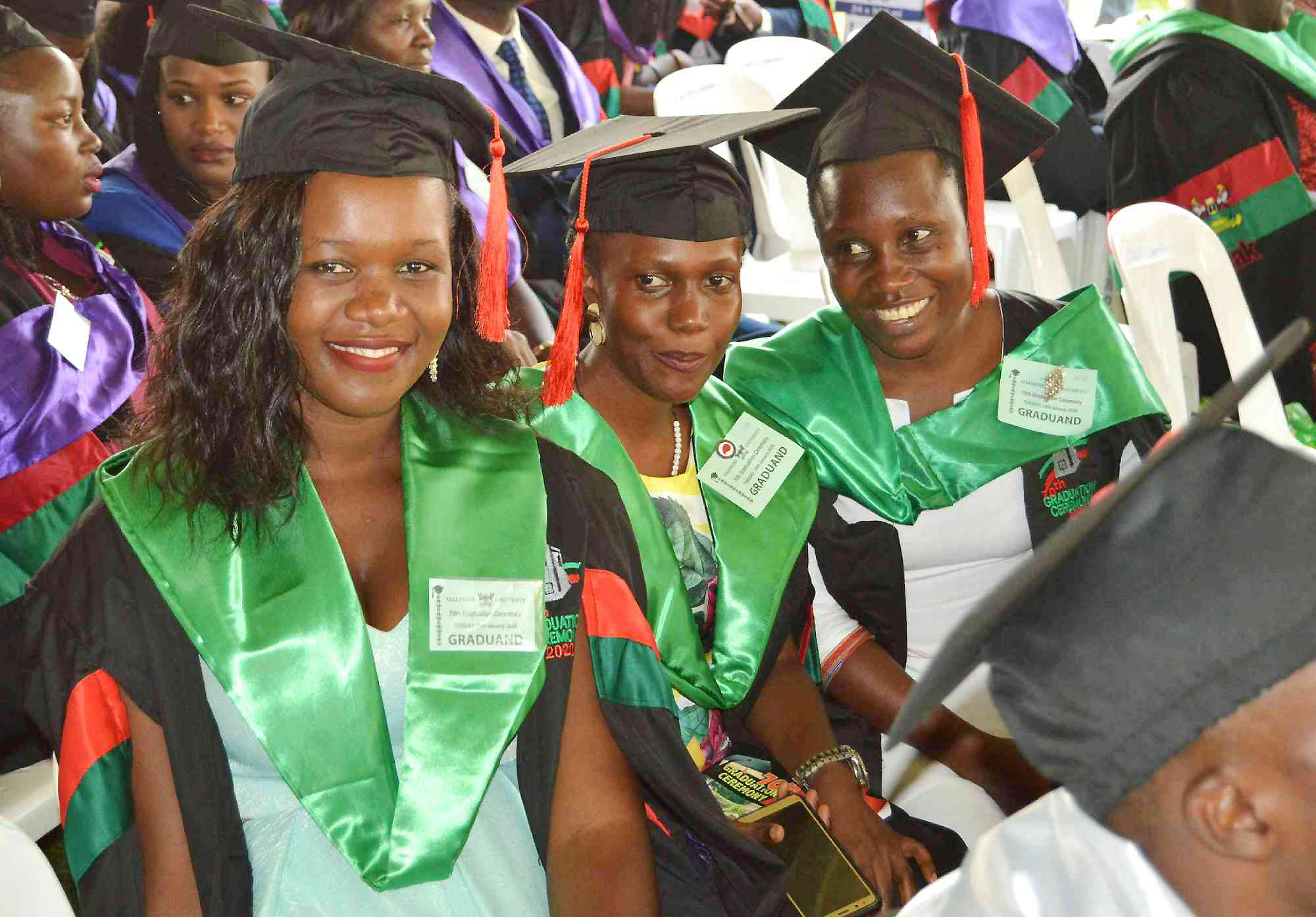 Some of the Female Masters Graduands from the College of Agricultural and Environmental Sciences (CAES) smile for the camera during Day 1 of the 70th Graduation Ceremony on 14th January 2020, Freedom Square, Makerere University.