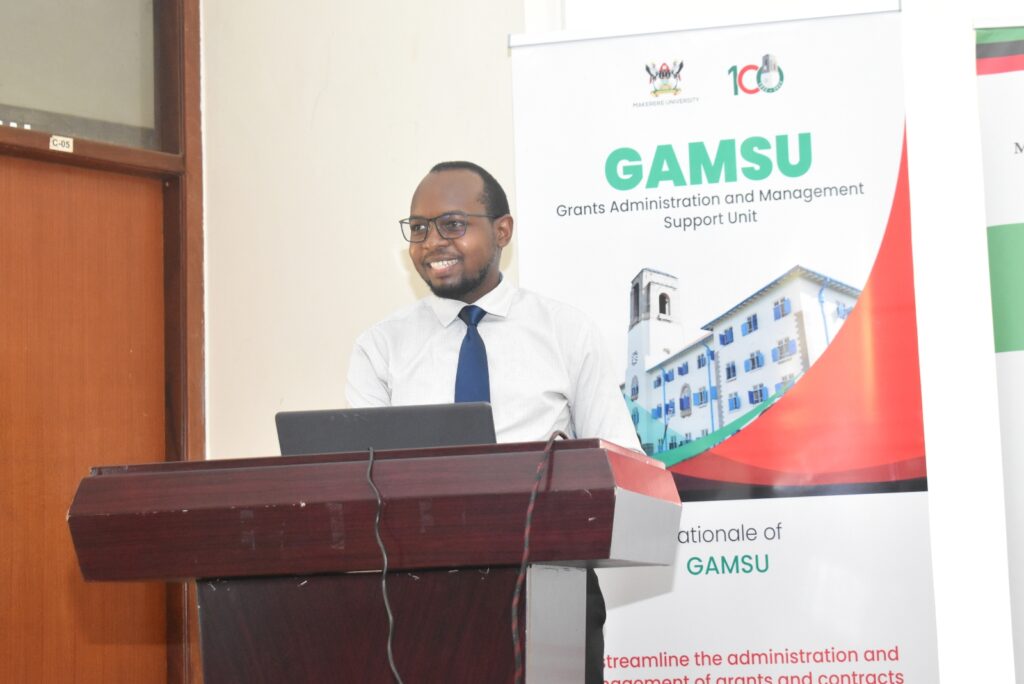 Mr. Laban Lwasa from GAMSU addressing staff on the Needs Assement tool during the meeting.