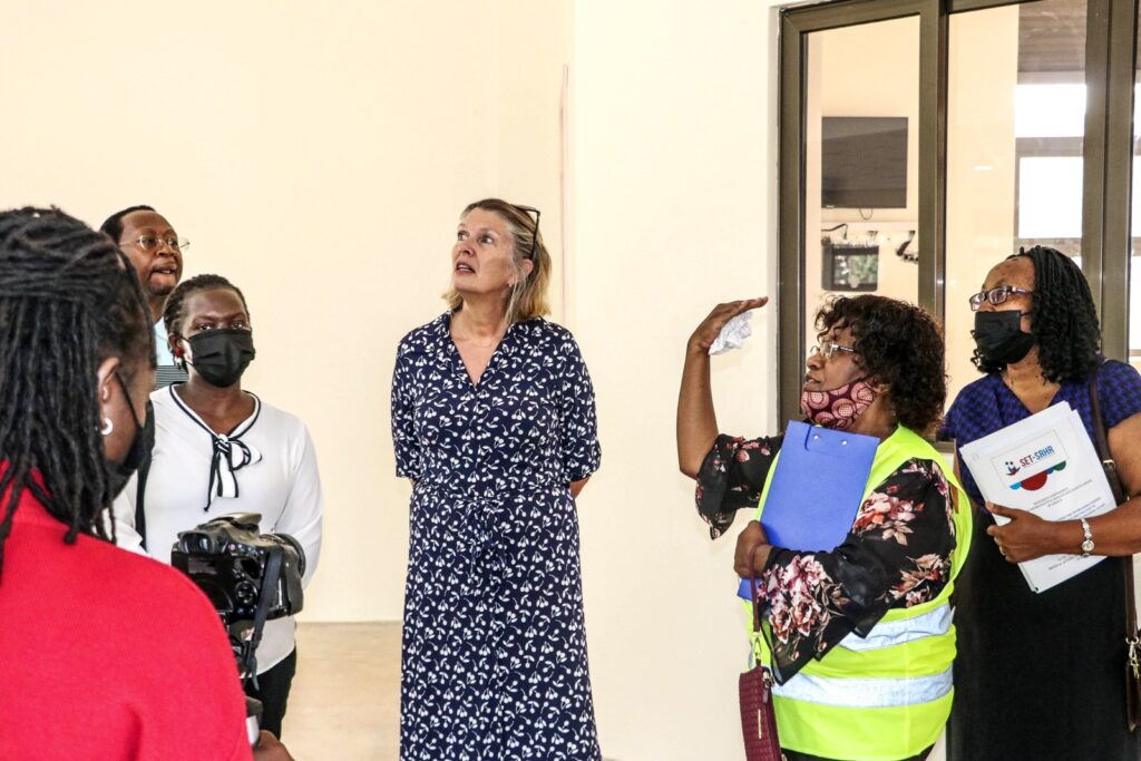 H.E. Dr. Karin Boven (C) receives a guided tour of the auditorium that is part of the New MakSPH home under construction at the Main Campus, Makerere University. 