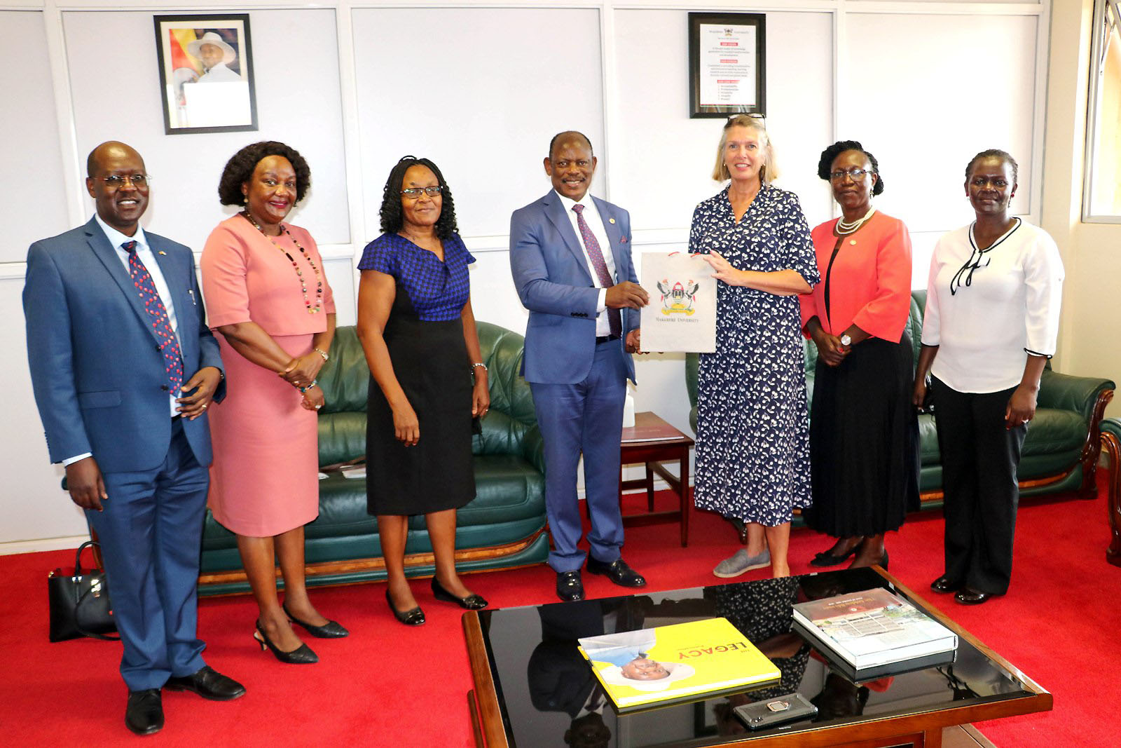 H.E. Dr. Karin Boven, Ambassador of the Netherlands to Uganda (3rd R) receives an assortment of Mak souvenirs from the Vice Chancellor, Prof. Barnabas Nawangwe (C) as the Dean MakSPH, Prof. Rhoda Wanyenze (2nd L) and other officials witness on 13th April 2022, CTF1, Makerere University.