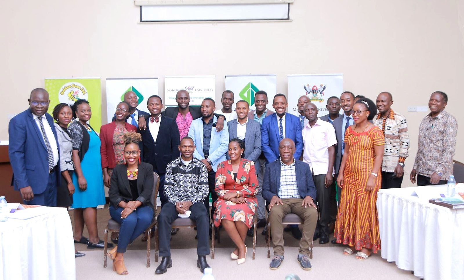 Seated: DVCAA-Prof. Umar Kakumba (2nd L), Ag. DVCFA-Prof. Henry Alinaitwe (R), Keynote Speaker & Youth MP Central-Hon. Kirabo Agnes (2nd R) and UDB’s Ms Barbara Kasekende (L) with Principal CoBAMS-Prof. Eria Hisali (Standing 2nd R), college leadership and some of the MBA students at the 1st Graduate Entrepreneurship Breakfast Pitch, 9th April 2022, Protea Hotel, Kampala.