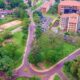 An aerial view of L-R: The Makerere University Guest House and Tennis Courts, Lincoln Flats, CoCIS Block B and Block A as seen by a drone hovering over the CCE Roundabout, Makerere University. Photo credit: KCCA