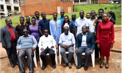 Participants in the multi-disciplinary training (Standing) with the trainers at The Carnegie African Diaspora Fellowship Program (CADFP) at College of Veterinary Medicine, Animal Resources and Biosecurity (CoVAB). Seated L-R are: Dr. Tamale Andrew, Collins Atuheirwe, Dr. Patrick Pithua – Virginia Polytechnic and State University and Assoc. Prof. Lawrence Mugisha from CoVAB, Makerere University in a group photo.