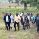 The Farm Manager, Dr. Wasswa Mathias (R) takes the Vice Chancellor-Prof. Barnabas Nawangwe (2nd R), University Secretary-Mr. Yusuf Kiranda (3rd R), Principal CoVAB-Prof. Frank Mwiine (L) and other officials on a guided tour of Buyana Stock Farm on 7th April 2022.