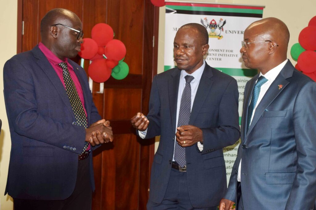 Assistant Commissioner Ministry of Finance Dr. Mugume Koojo, Prof. Eria Hisali and Prof Edward Bbaale interacting after the inauguration.