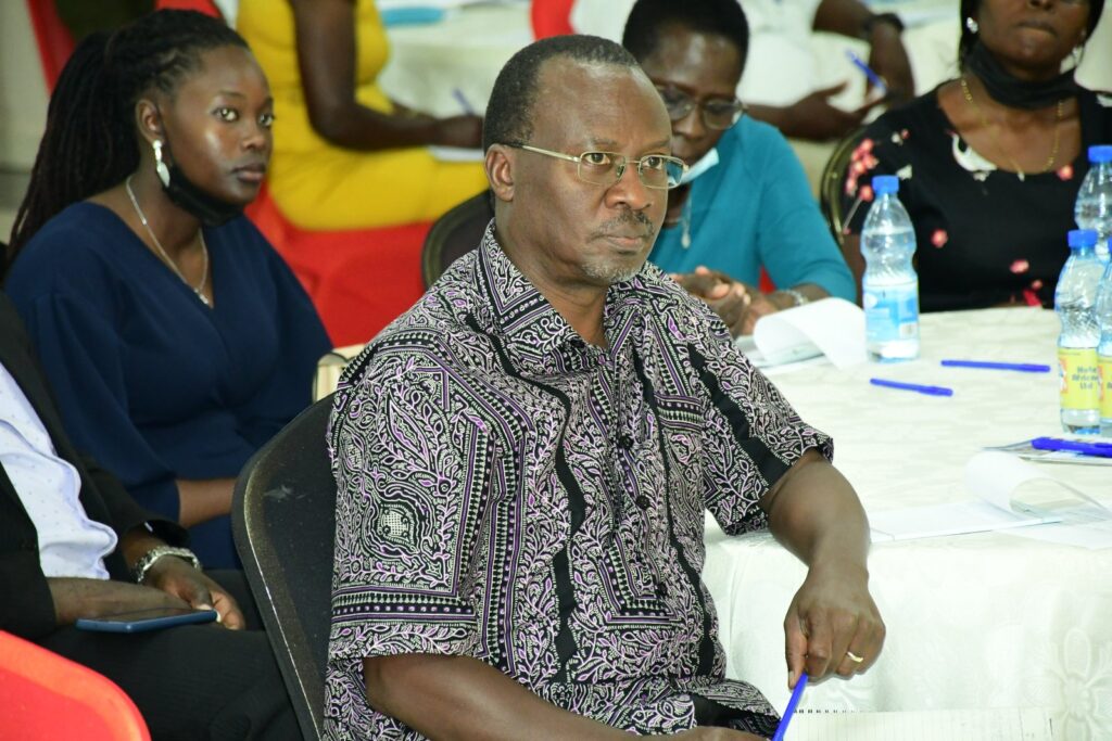 Family Life Network Executive Director Mr. Stephen Langa (Foreground) is one of the MCFSP Mentors. Ms. Sandra Mukoya (Background) spoke on behalf of the Scholars. 