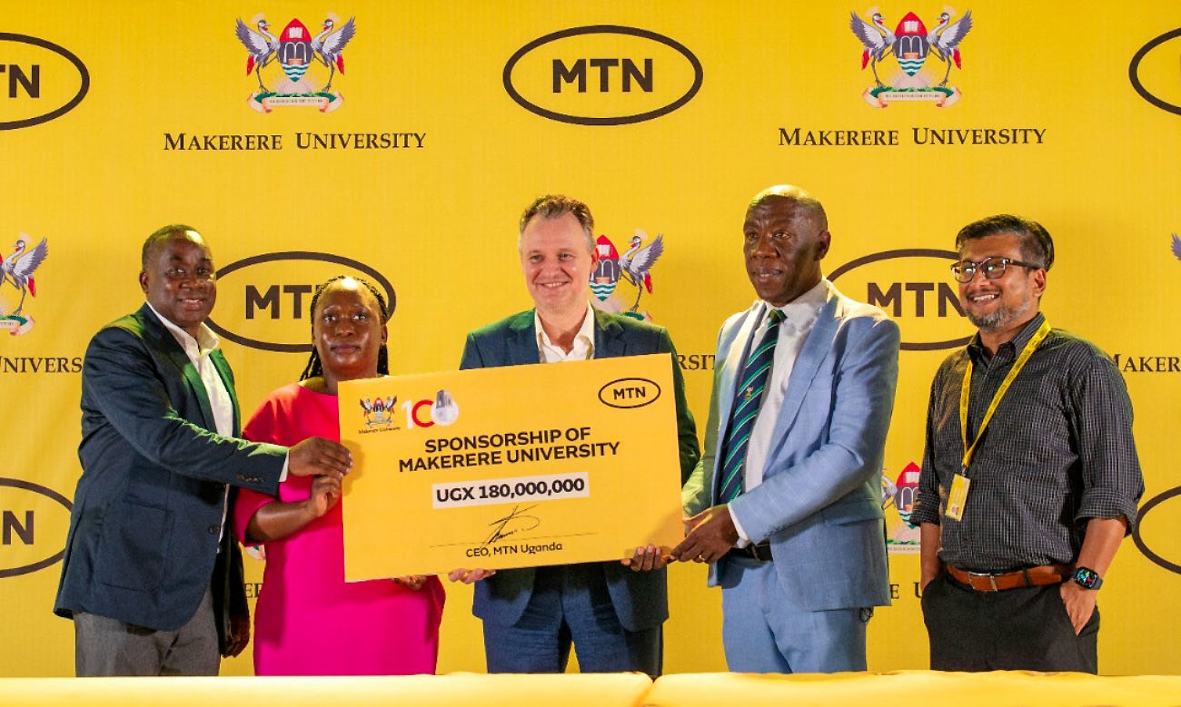 The DVCFA-Prof. Henry Alinaitwe (2nd R) and MTN Uganda CEO-Wim Vanhelleputte with L-R: CEO Mak@100 Secretariat-Mr. Awel Uwihanganye, Manager PR/Logistics Mak@100 Secretariat-Ms. Hawa Ndagire Kajumba and MTN Uganda Chief Marketing Officer (CMO)-Mr. Somdev Sen at the unveiling of UGX180million support by MTN in favour of the Centenary Celebrations on 4th May 2022. Courtesy Photo.