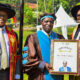 Mak Council Chairperson Mrs. Lorna Magara (R) hands over a framed certificate to Prof. William Bazeyo (C) in appreciation of his service to Makerere University, during the First Session of the 72nd Graduation on Monday 23rd May 2022 at the Freedom Square. Left is the Vice Chancellor Prof. Barnabas Nawangwe.