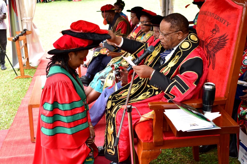 Prof. Ezra Suruma confers the PhD upon Dr. Catherine Mulinde.