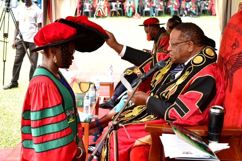 Prof. Ezra Suruma confers the PhD upon Dr. Syofuna Agatha.