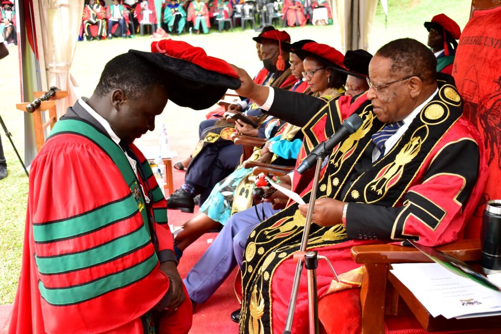 Dr. Tonny Obua, one of the PhD graduates from CAES receiving his doctorate from the Chancellor.